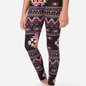 A lot of 7pcs brand new Justice girls leggings and long sleeve tops.